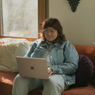 Image of a woman researching renter's insurance on her computer.
